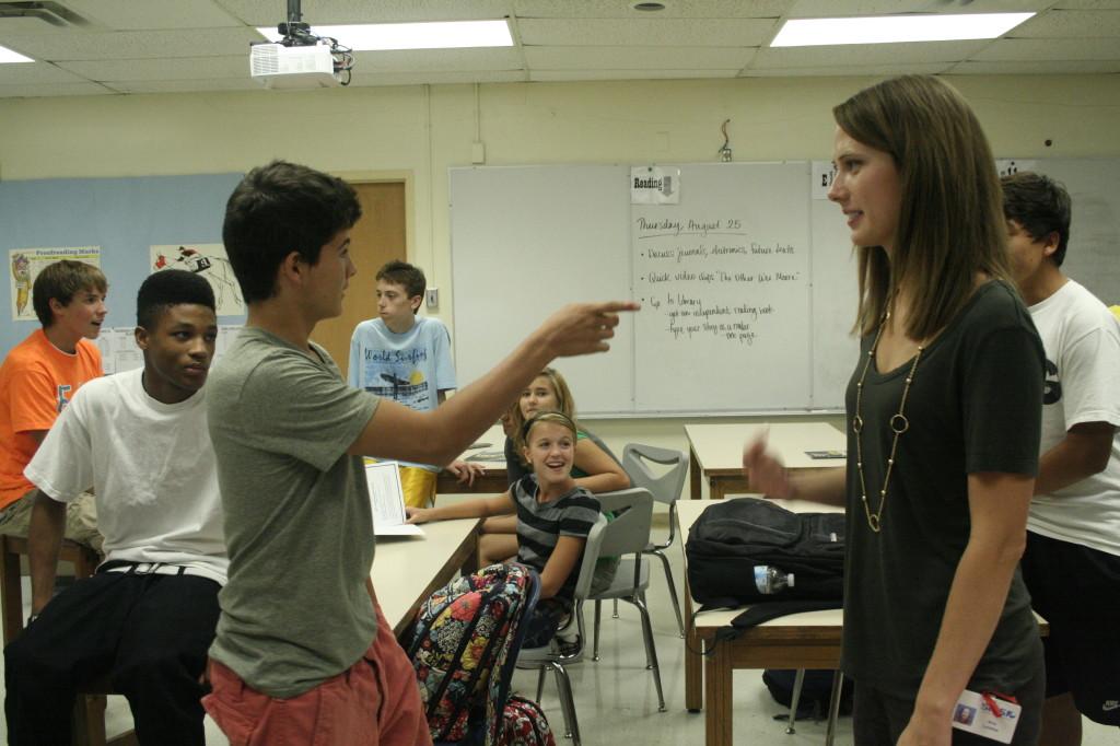 Amy Blakemore (right) and a student (left) act out during a class discussion.