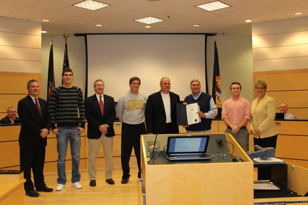 The football team was honored at the Lenexa City Council meeting on December 4, 2012 for their 6A state championship win. Mayor of Lenexa, Michael Boehm, senior captain Alec Dinges, assistant coach John Stonner, head coach Tim Callaghan, principal Dr. Charles McLean, senior captain Joel Spiller, Lenexa Ward 4 City Council member Mandy Stuke. 