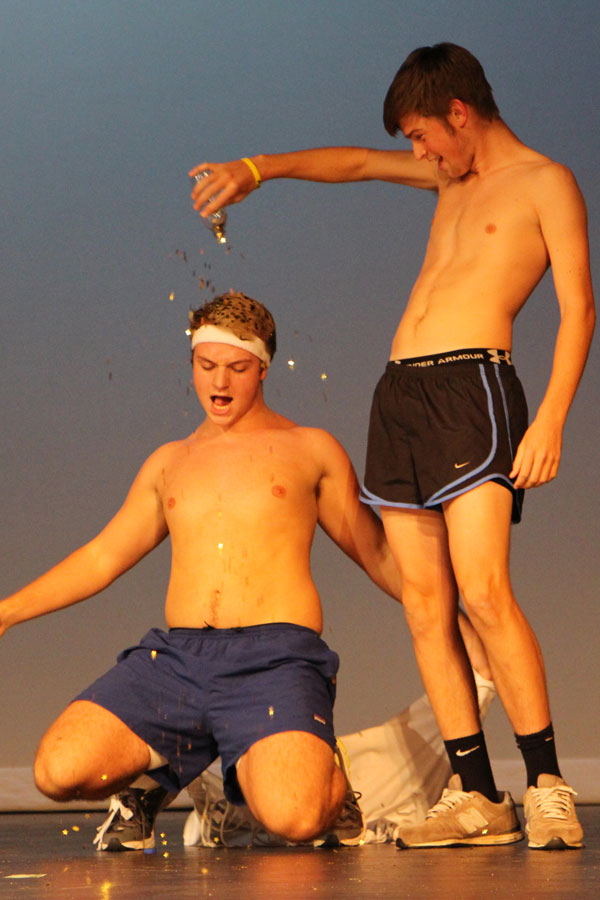 Martin Higgins pours some sugar on Jacob Overholtzer in the 14 boys performance.