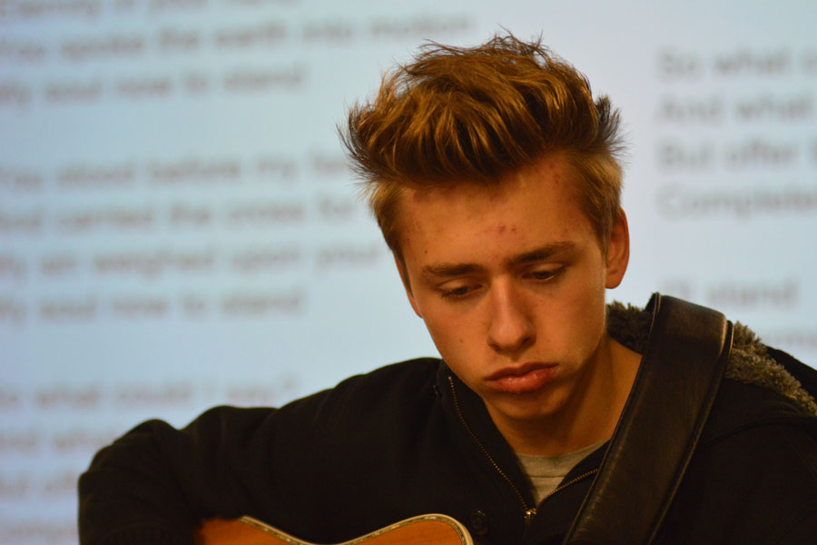 Freshman Jordan Mills plays guitar at Club 121