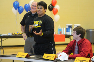 Marquan Osbey signed to play football at Fort Scott.