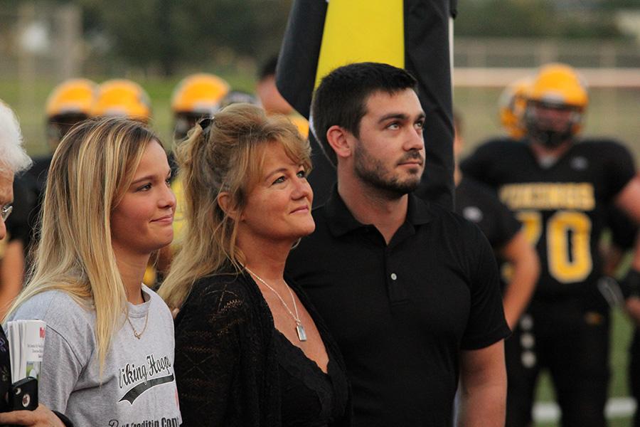 Kevin Crows family accepts his 12th Man honor.