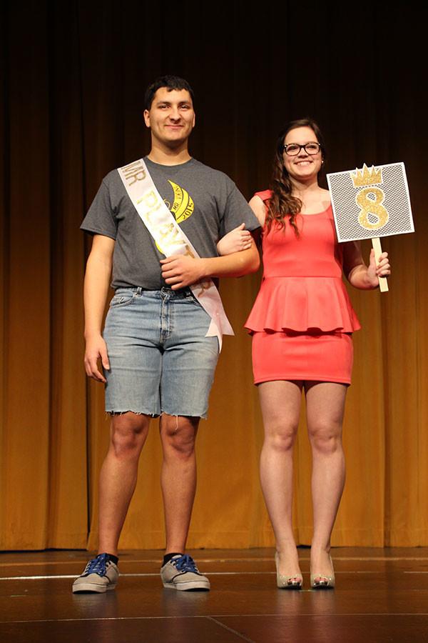 Pageant contestants strut across the stage with their escorts during the opening of the Mr. Viking pageant.