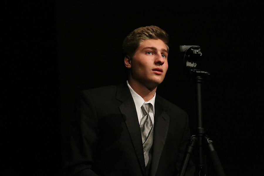 Senior Andrew Ferguson uses technology to showcase his eyebrow dancing talent to the crowd.