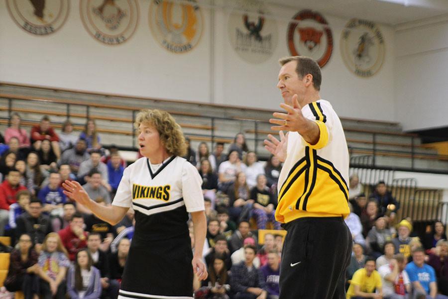 Principal Steve Loe and teacher Kelly Gill perform for students.