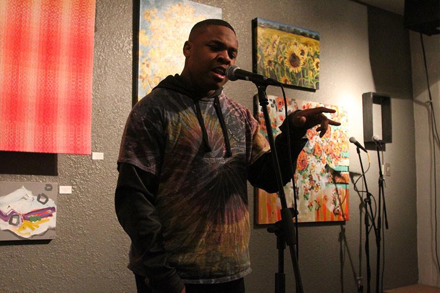 Junior Julius Maddox performs his poetry at the Louder Than a Bomb KC competition.