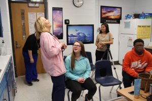 Mortimer laughs at a student's joke. Part of her job, she explains, is being able to make connections with students at West.