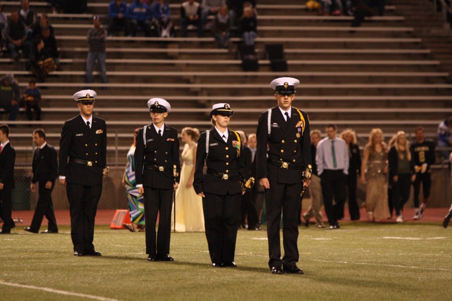 Cadets standing at attention at the 2015 homecoming game