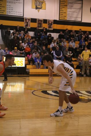 Jack McMahon takes the ball up the court against SM Northwest