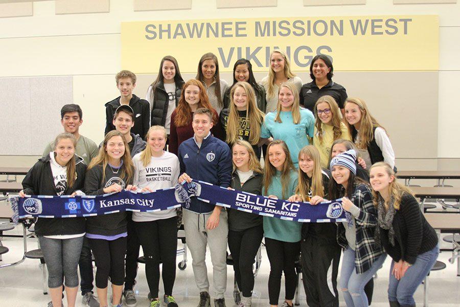 The entire championship team poses for a picture with Besler