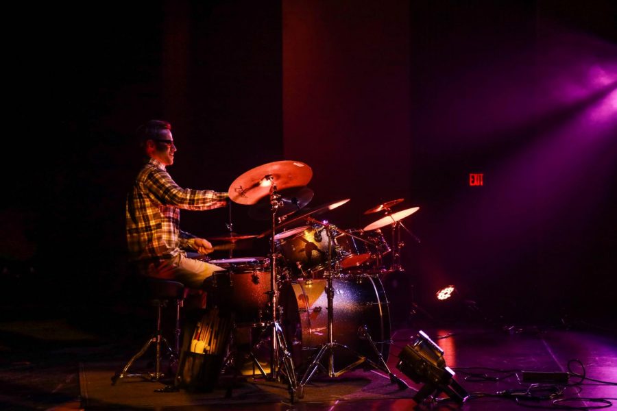 Professional drummer performs during the counting of scores.