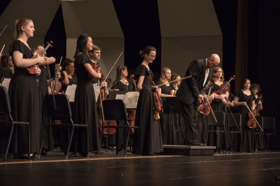 Mr. Mulvenon bows after Shawnee Mission Wests performance 