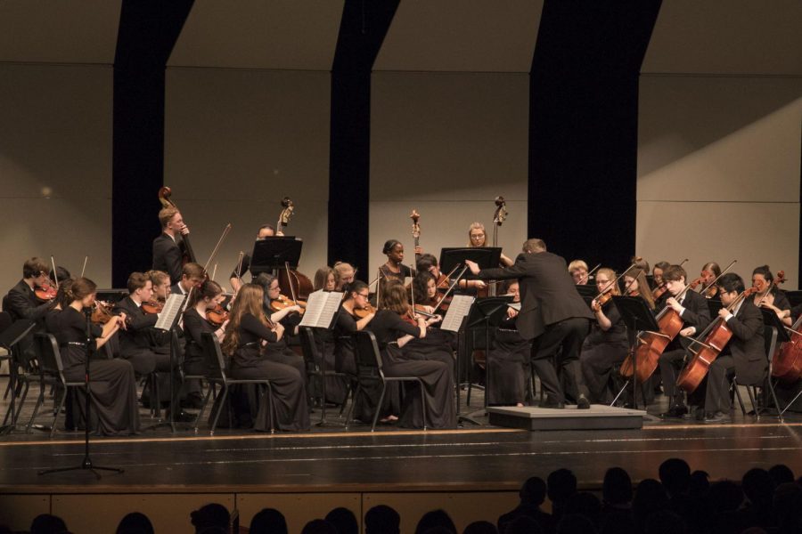Mr. Wiebe passionately conducts Shawnee Mission Souths orchestra