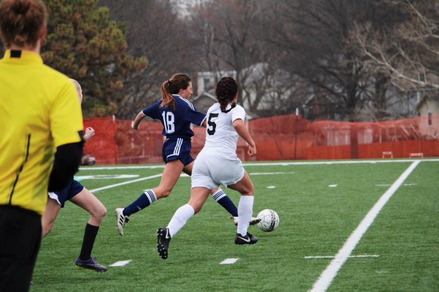 #5, Naomi Oliva, attempts to steal the ball from BVN.