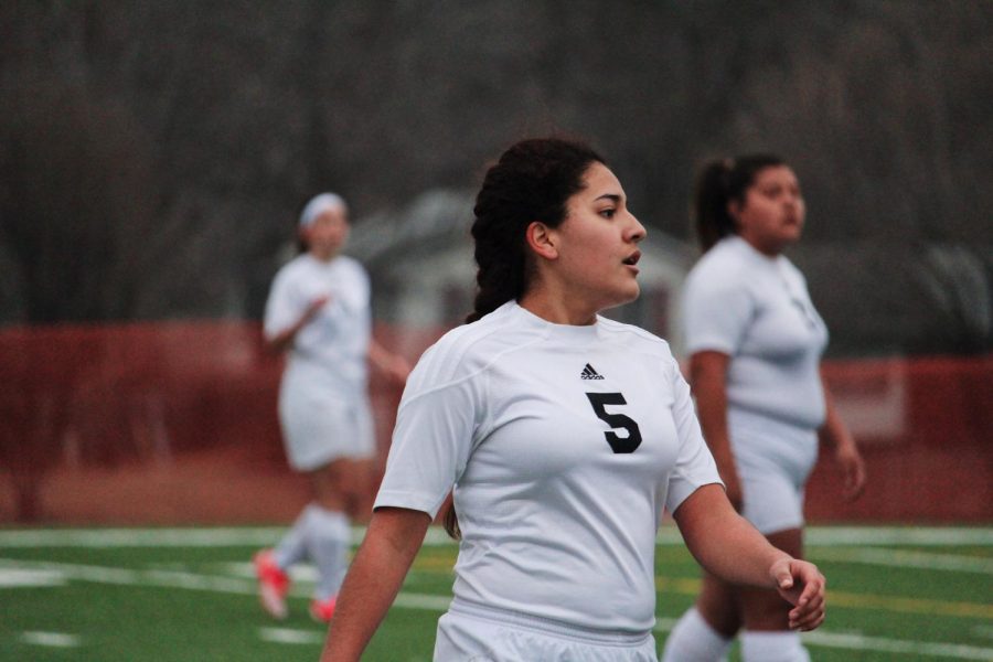 Naomi Oliva tiredly looks out to her goalie. 