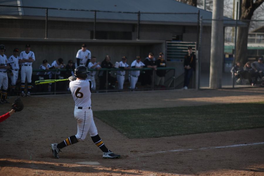 Trevor McCollum hits the ball for a single. 