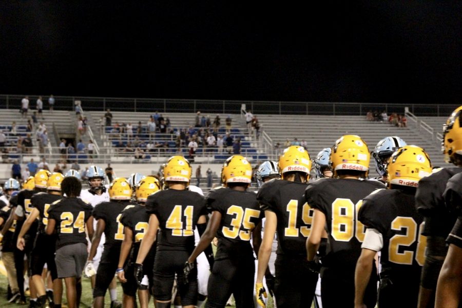 Teammates line up to greet SME players after their first win of the season.